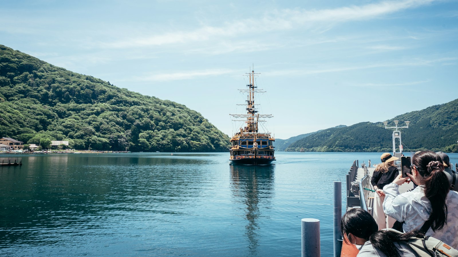 A sightseeing boat arriving at a pier on Lake Ashi, Hakone