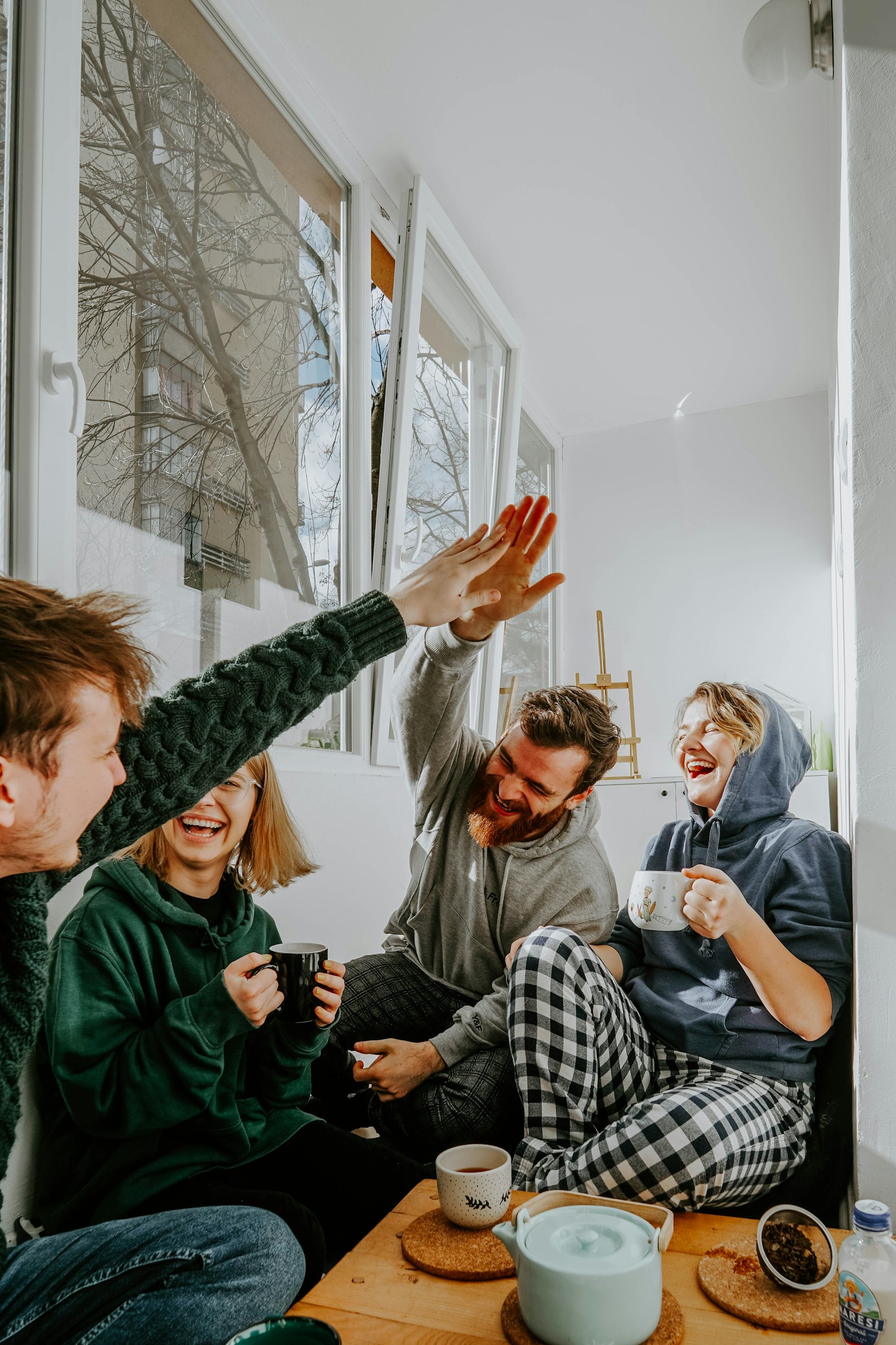 A group of friends laughing together while traveling