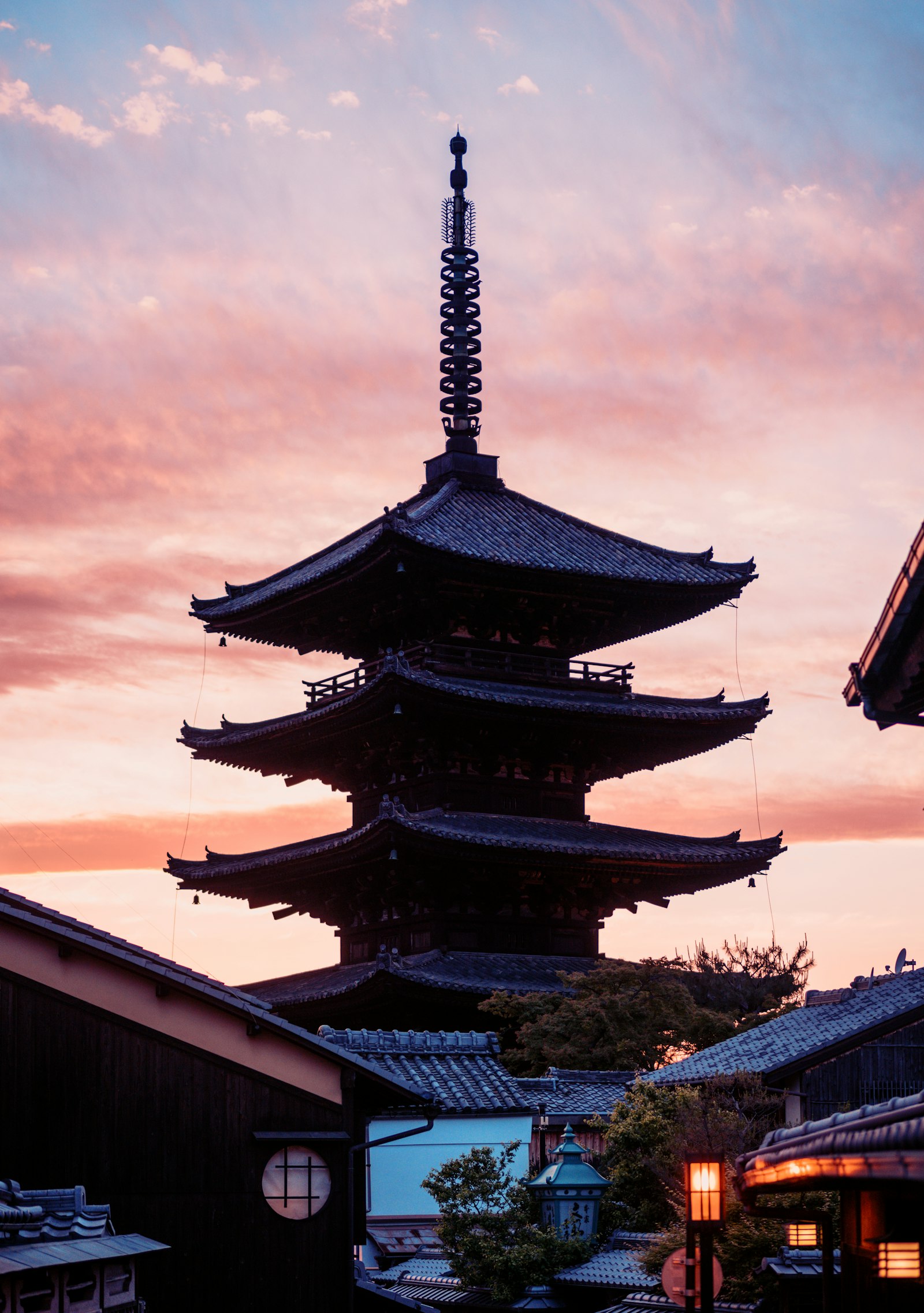 A traditional temple in Kyoto surrounded by greenery